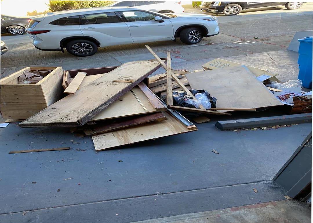 picture of a a bunch of junk and moldy wood that is about to be removed